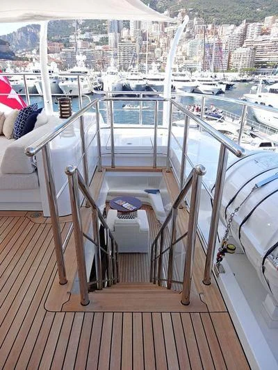 a deck with a deck overlooking a city aboard STARBURST IV Yacht for Charter