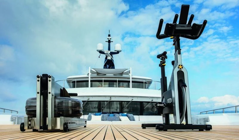 a large white ship with a large gun on top aboard STARBURST IV Yacht for Charter