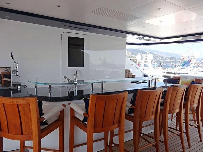 a room with a table and chairs aboard STARBURST IV Yacht for Charter