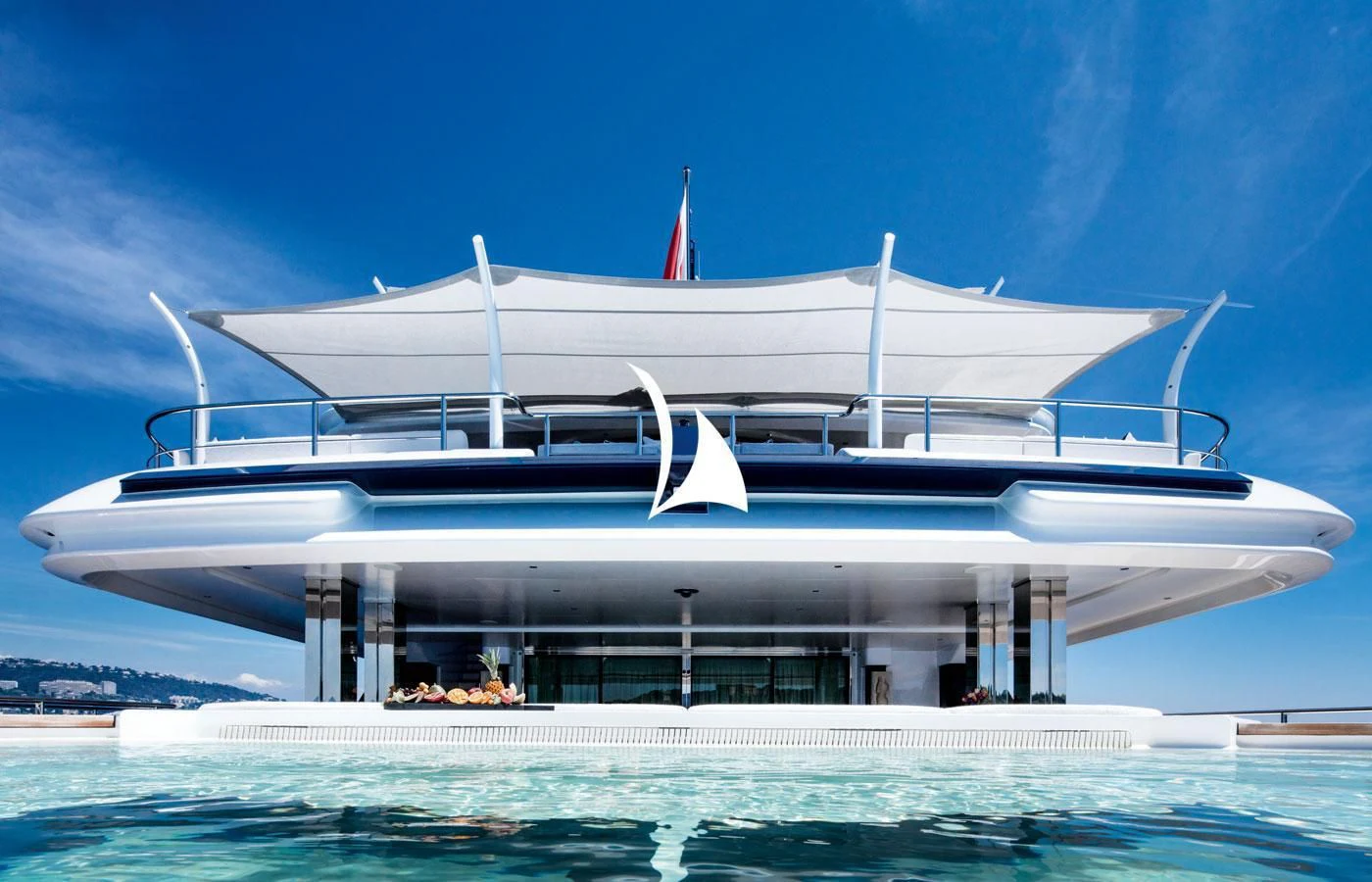 a large building with a white roof aboard STARBURST IV Yacht for Charter