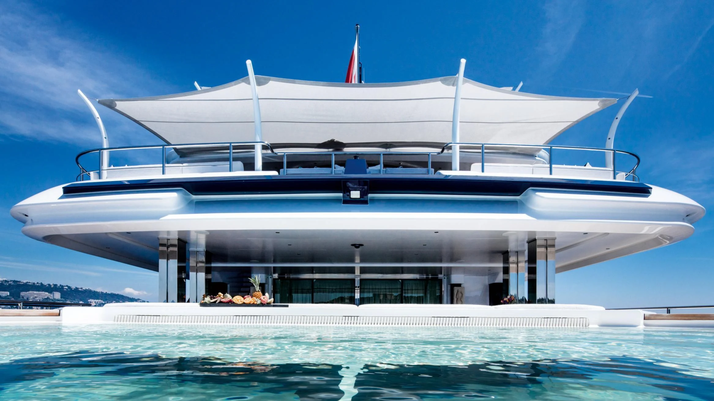 a large white building with a flag on top aboard STARBURST IV Yacht for Charter