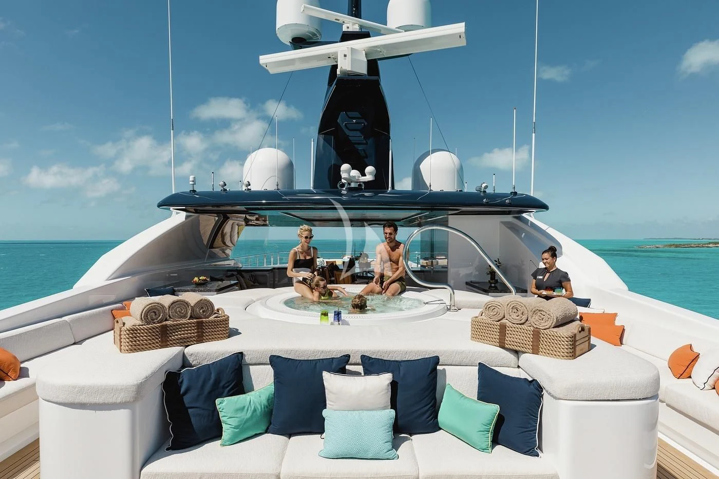 a boat with a couple of people on it aboard STARBURST IV Yacht for Charter