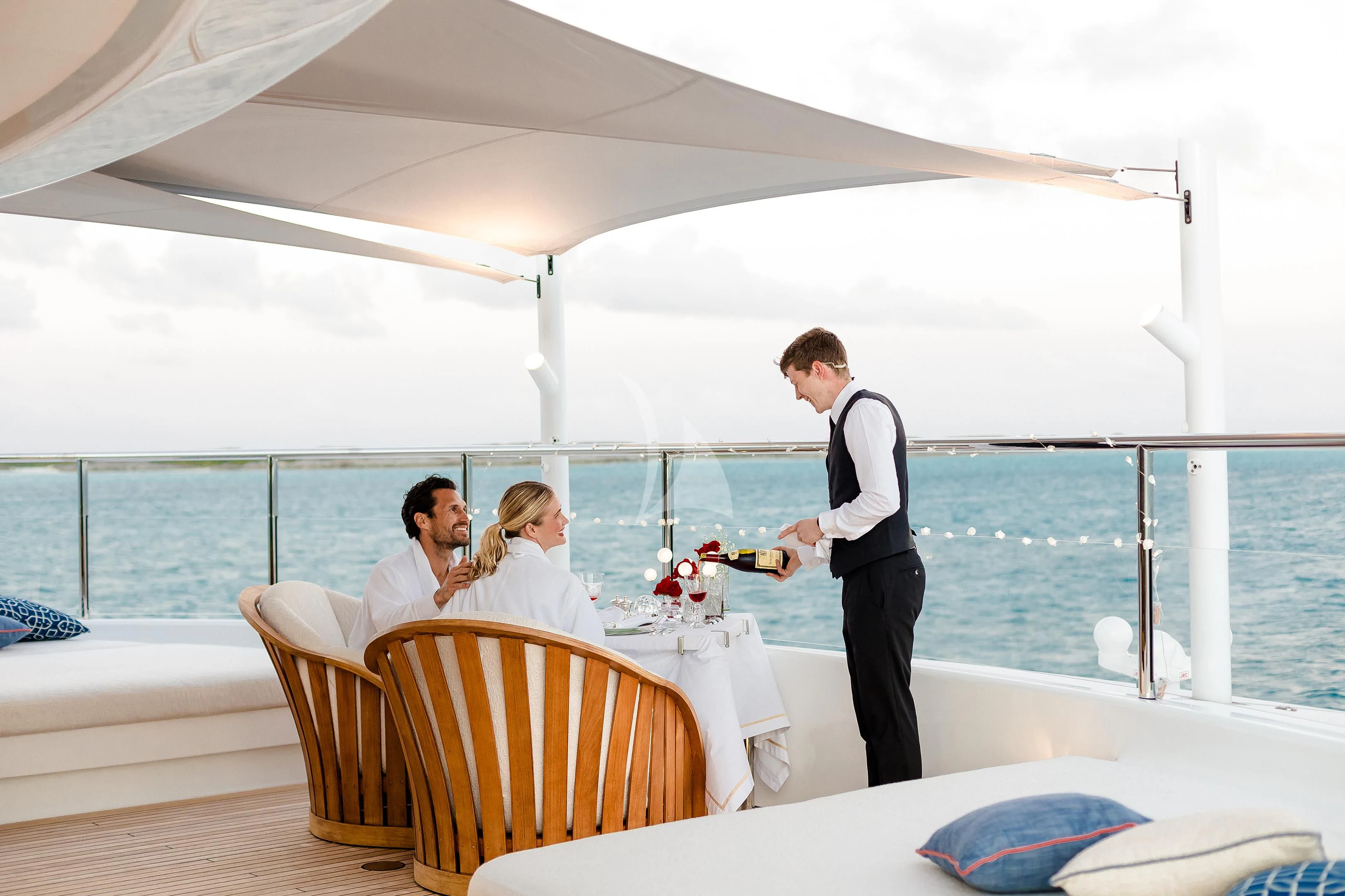 a man and a woman standing on a boat aboard STARBURST IV Yacht for Charter