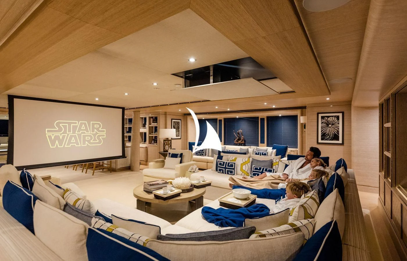 a group of people in a room aboard STARBURST IV Yacht for Charter