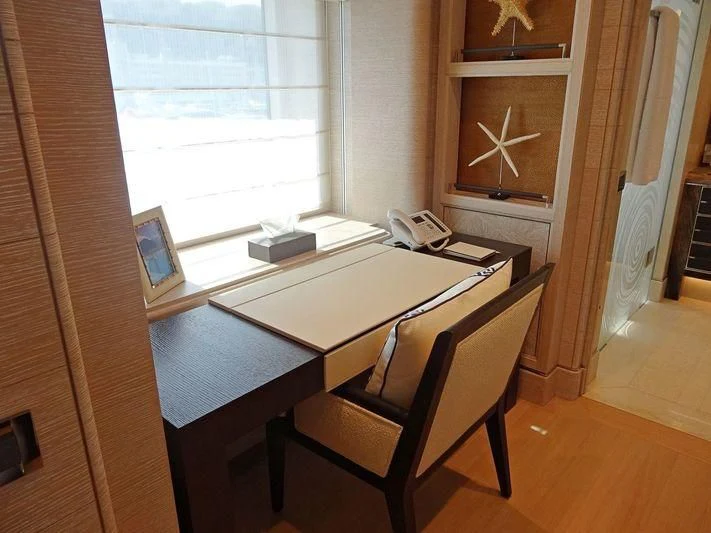 a desk with a phone on it aboard STARBURST IV Yacht for Charter