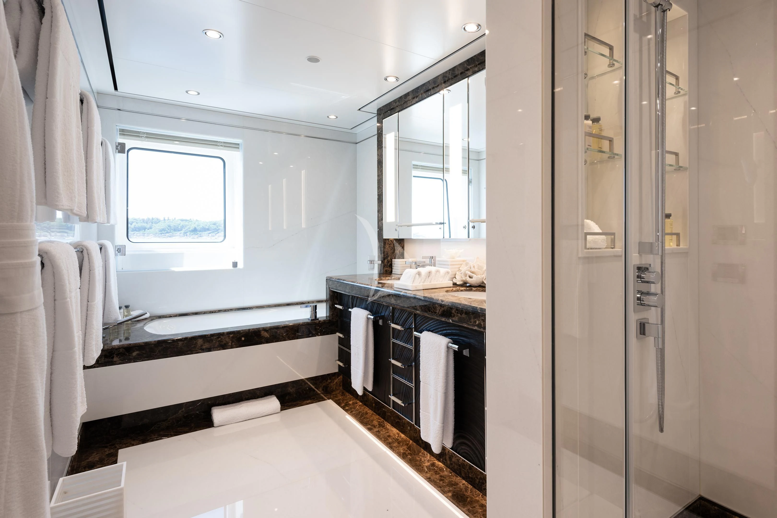 a bathroom with a sink and a mirror aboard STARBURST IV Yacht for Charter