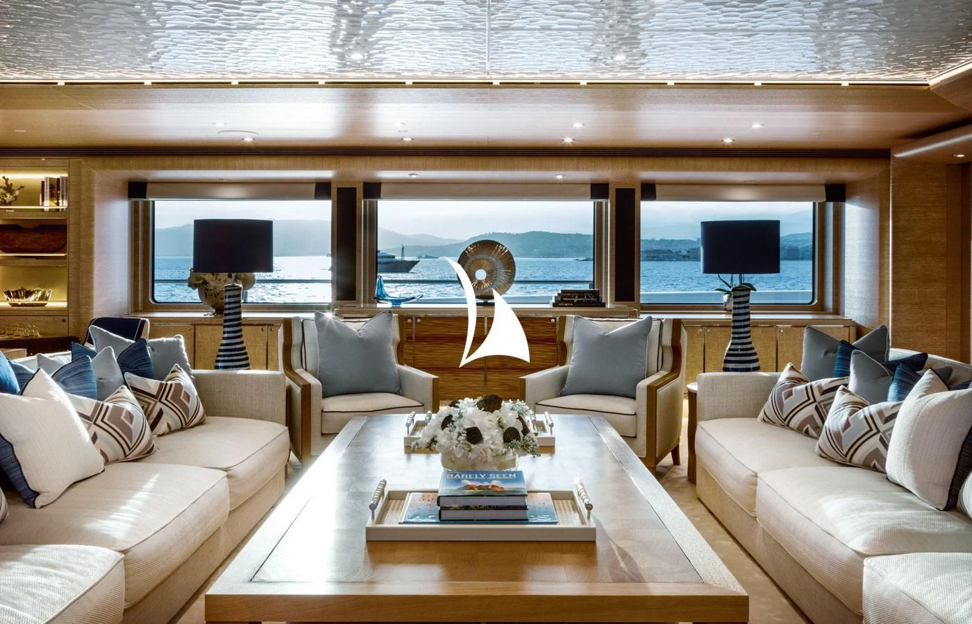 a living room with a large window aboard STARBURST IV Yacht for Charter