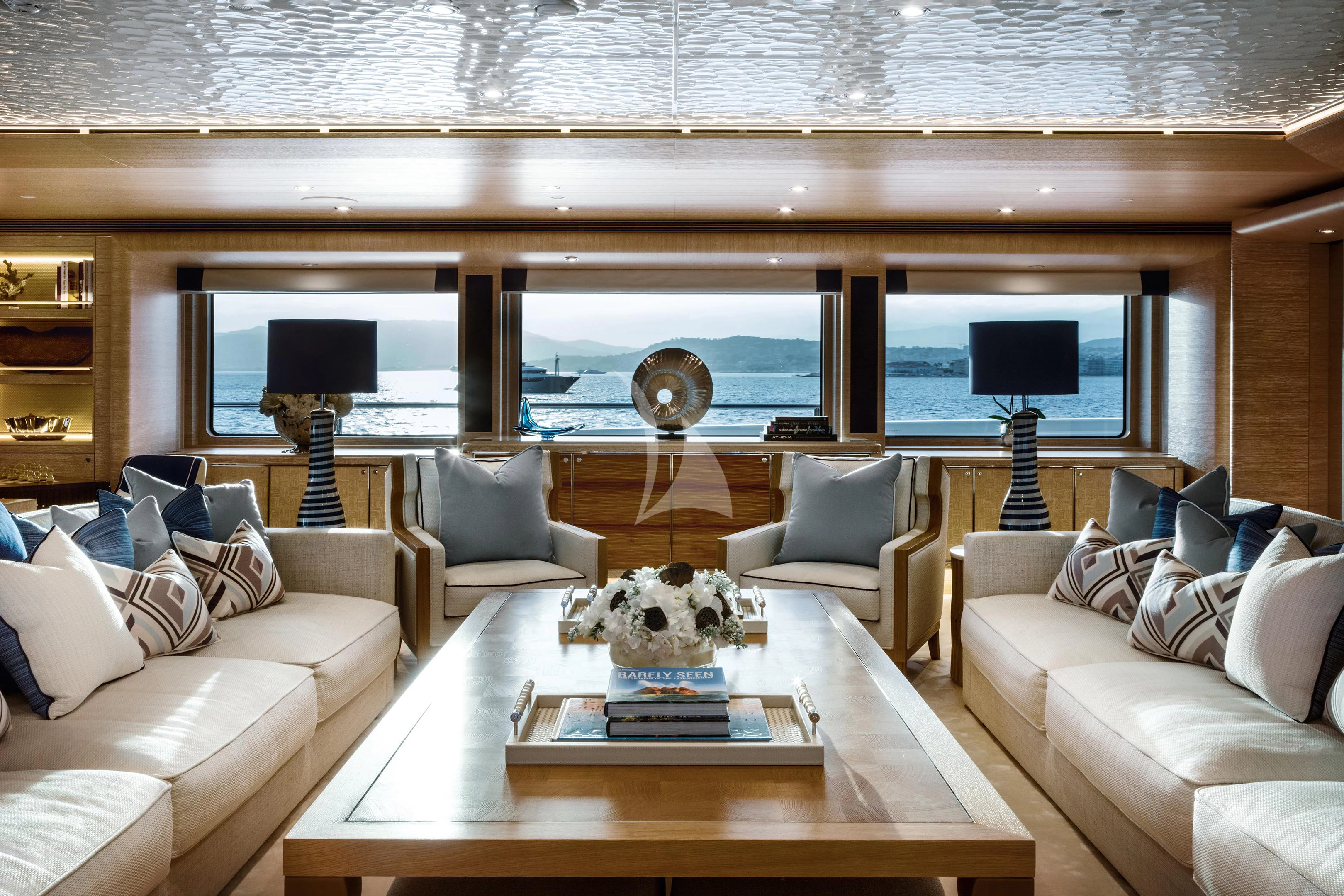 a living room with a large window aboard STARBURST IV Yacht for Charter