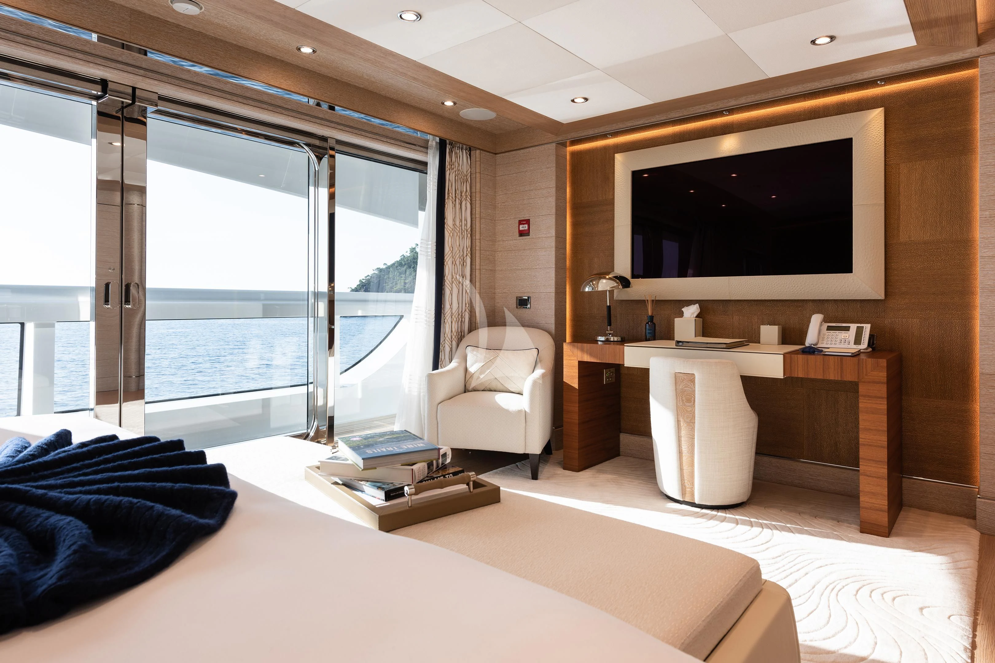 a room with a bed and a tv aboard STARBURST IV Yacht for Charter