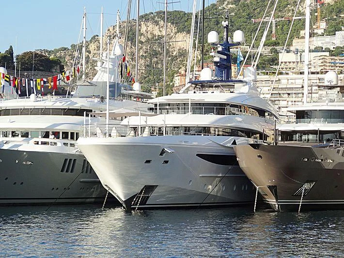 a large white boat in the water aboard STARBURST IV Yacht for Charter