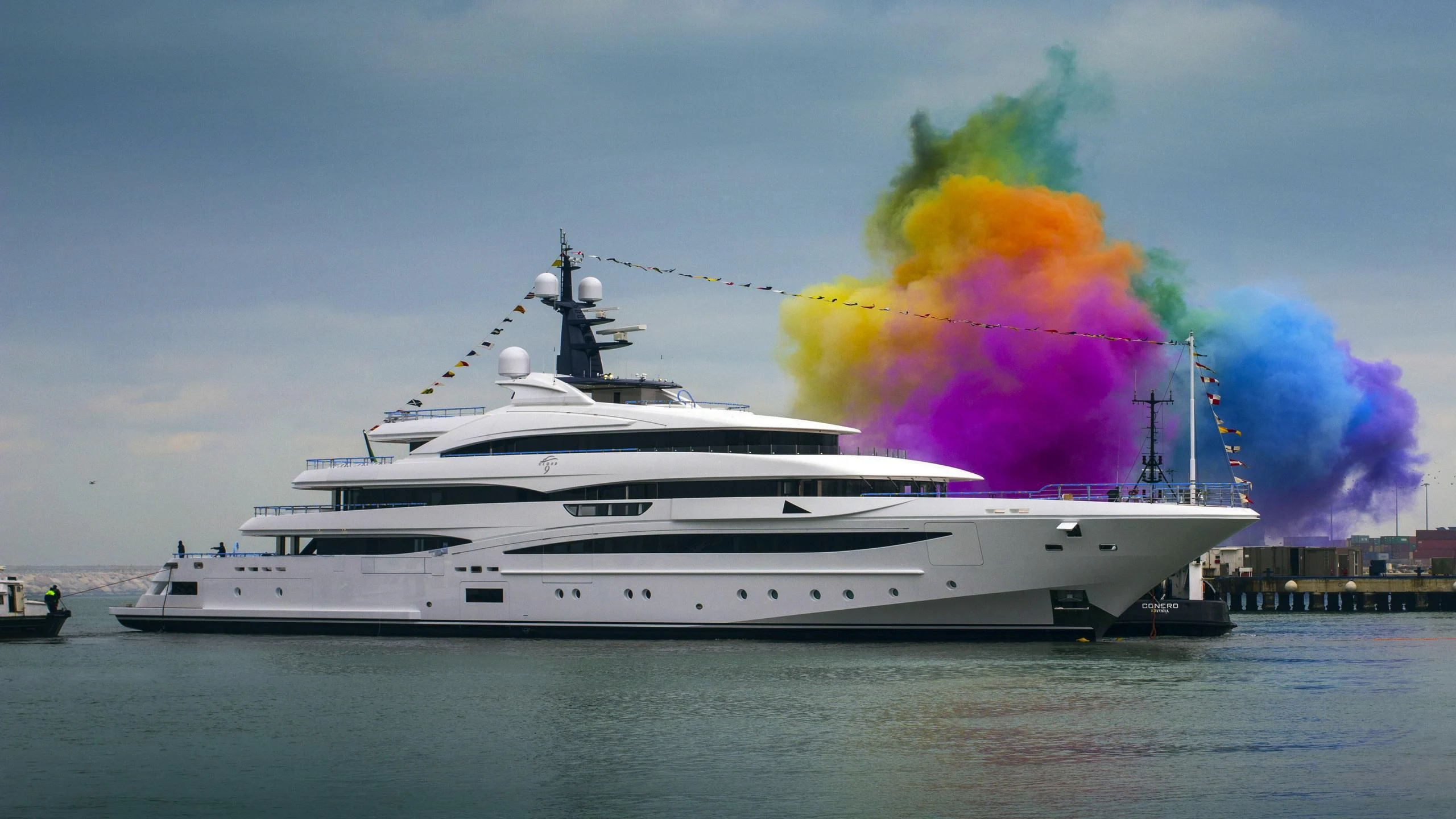 a large white yacht with a large cloud of smoke coming out of it aboard STARBURST IV Yacht for Charter