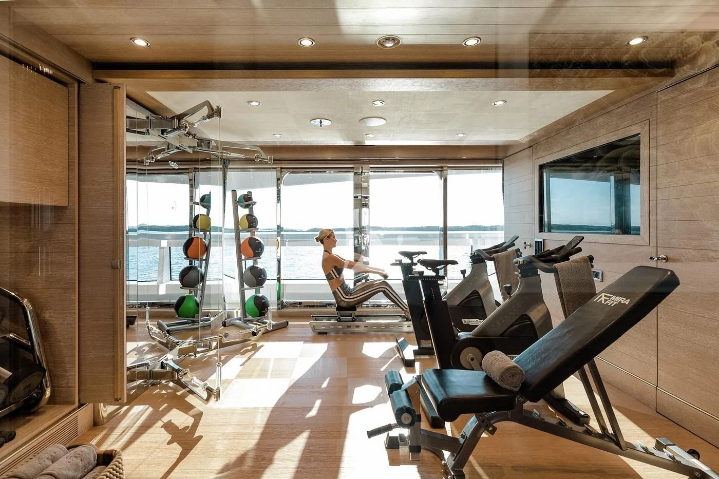 a person working out in a gym aboard STARBURST IV Yacht for Charter