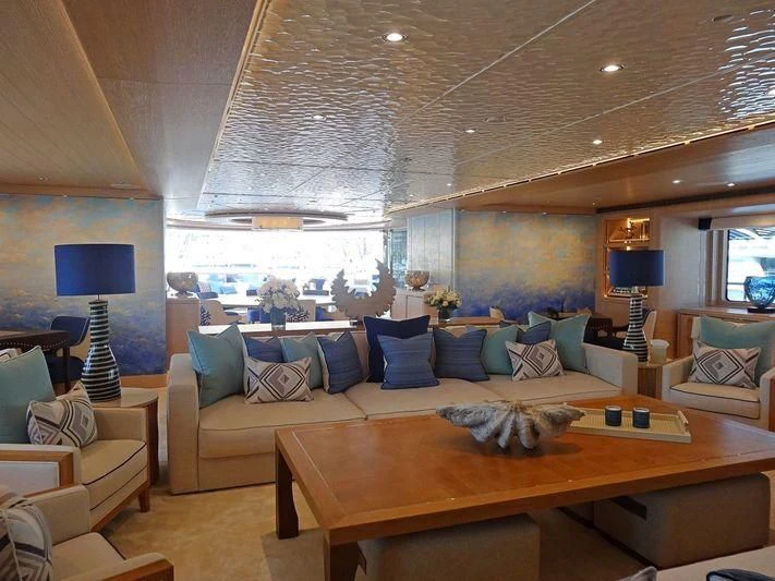 a living room with a large sofa aboard STARBURST IV Yacht for Charter