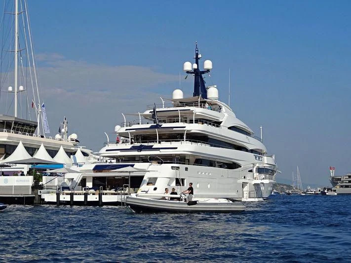 a large white boat in the water aboard STARBURST IV Yacht for Charter