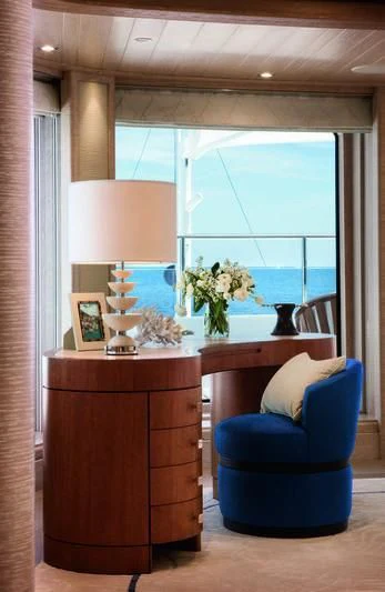 a room with a desk and a chair aboard STARBURST IV Yacht for Charter