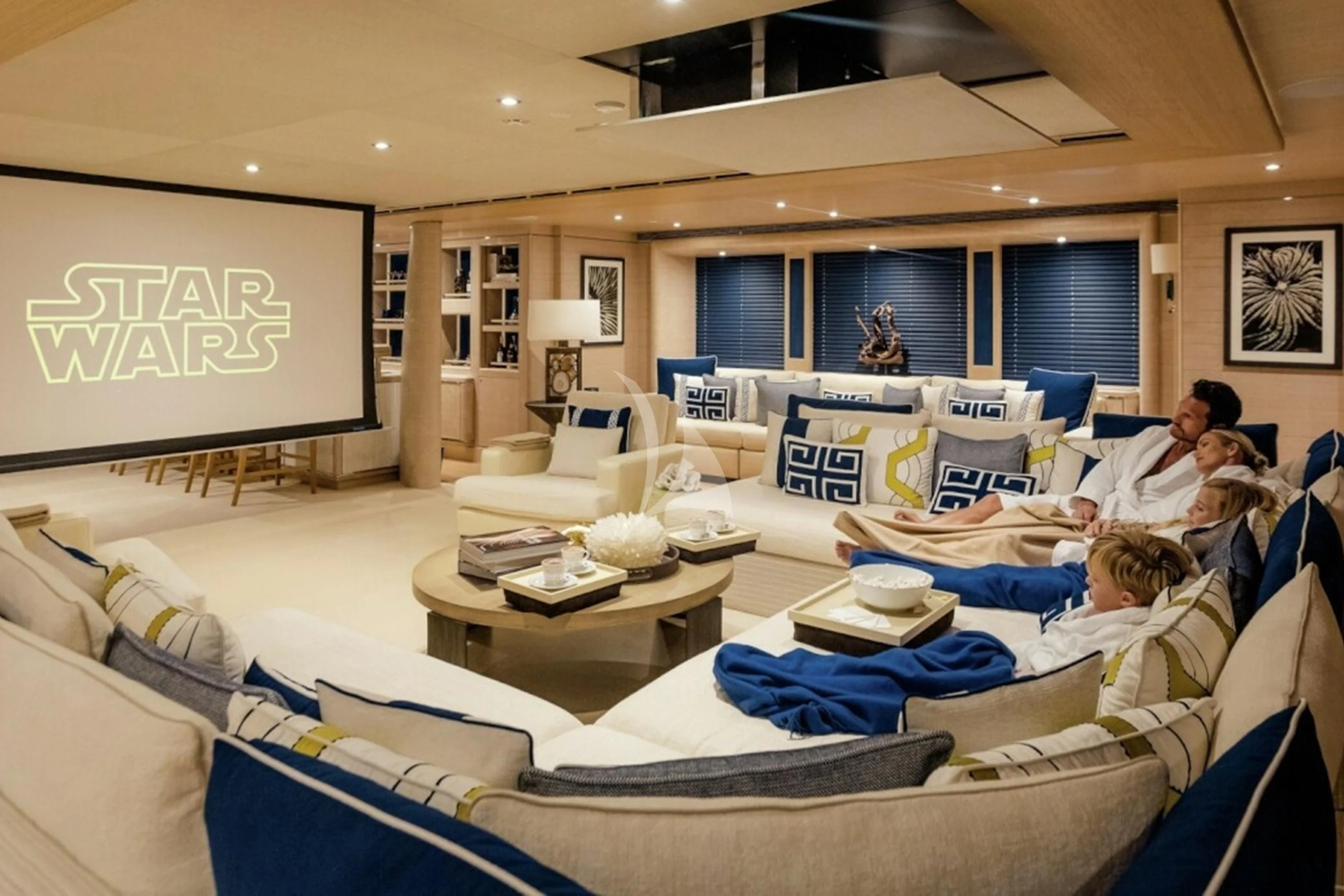a group of people in a room aboard STARBURST IV Yacht for Charter