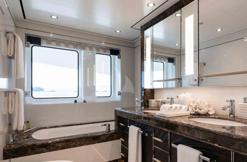 a bathroom with a large mirror aboard STARBURST IV Yacht for Charter