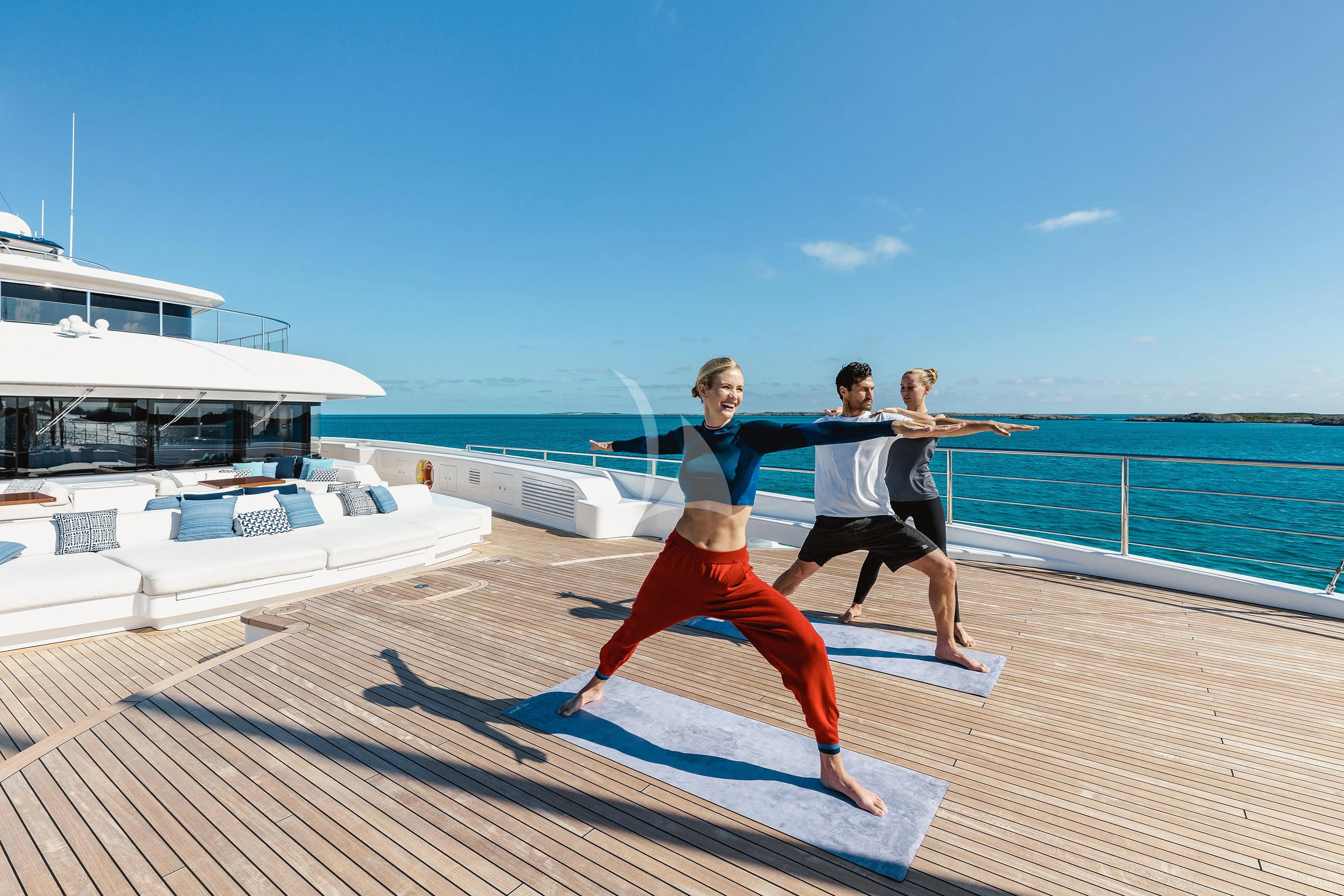 a group of people jumping on a dock aboard STARBURST IV Yacht for Charter