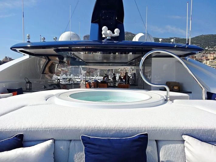 a boat with a large white boat aboard STARBURST IV Yacht for Charter