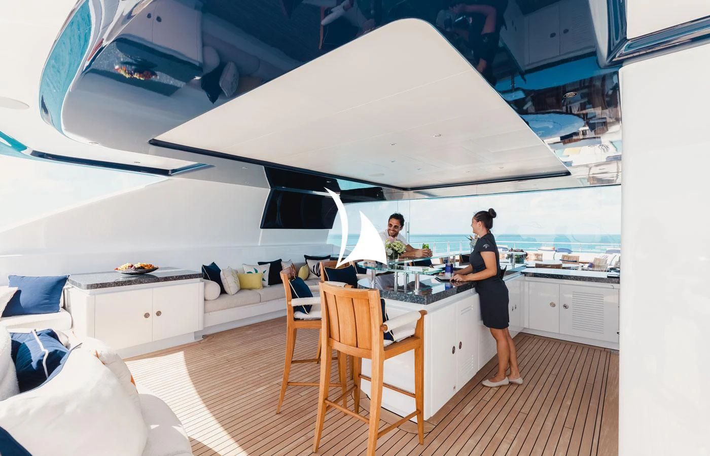 a person standing in a kitchen aboard STARBURST IV Yacht for Charter