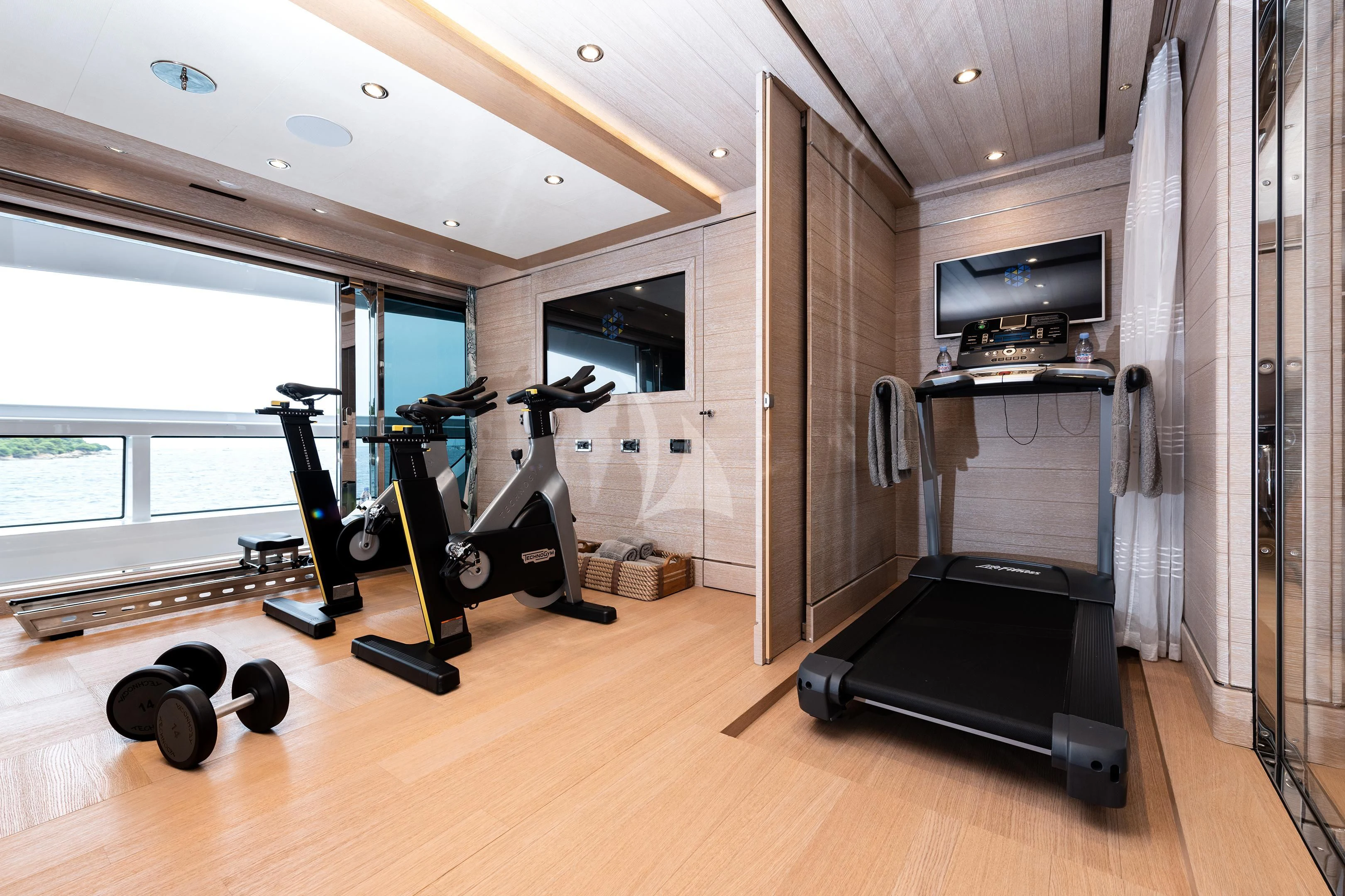 a gym with exercise equipment aboard STARBURST IV Yacht for Charter