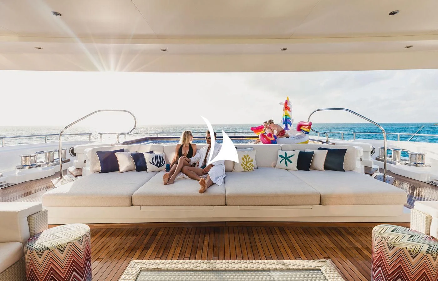 a person sitting on a couch aboard STARBURST IV Yacht for Charter