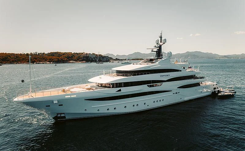 a large white yacht on the water aboard STARBURST IV Yacht for Charter