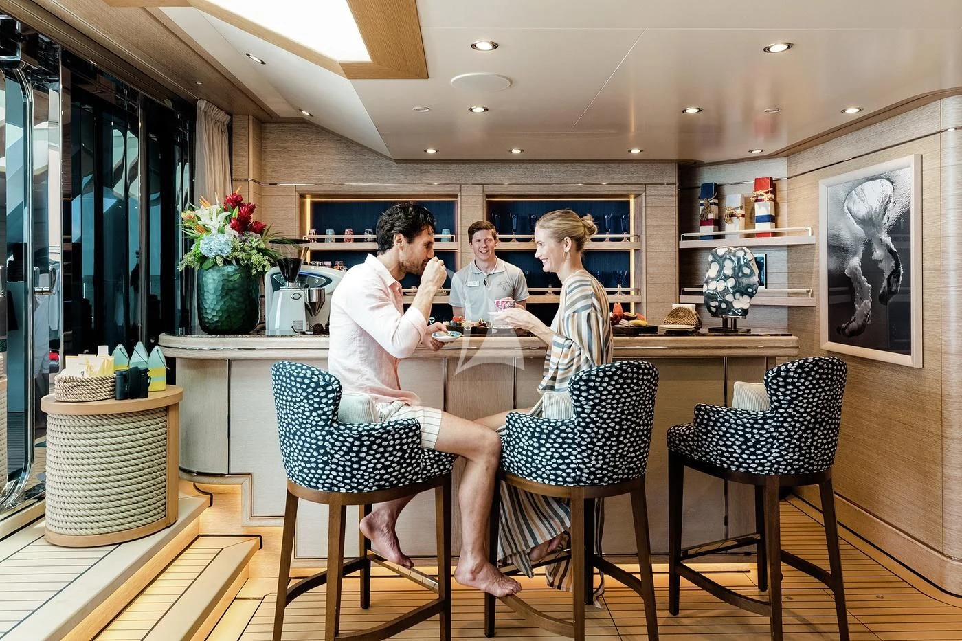 a group of people sitting around a table aboard STARBURST IV Yacht for Charter