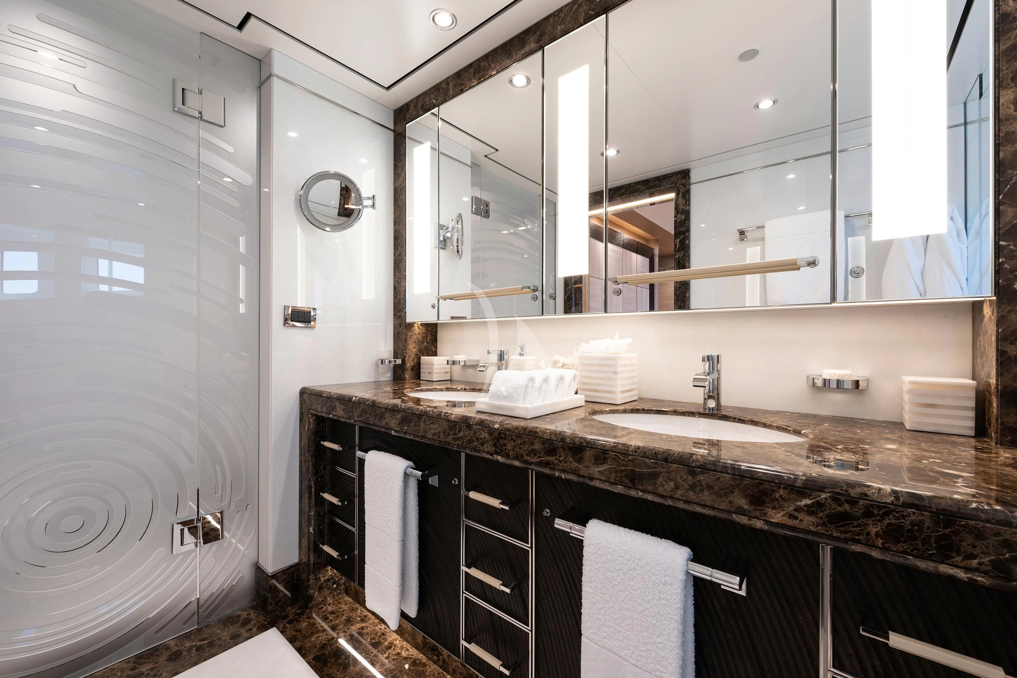 a bathroom with a large mirror aboard STARBURST IV Yacht for Charter