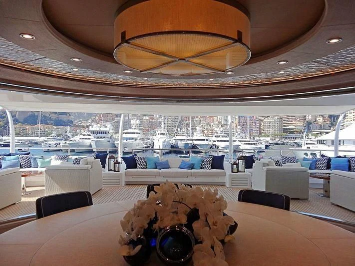 a large room with a large chandelier aboard STARBURST IV Yacht for Charter
