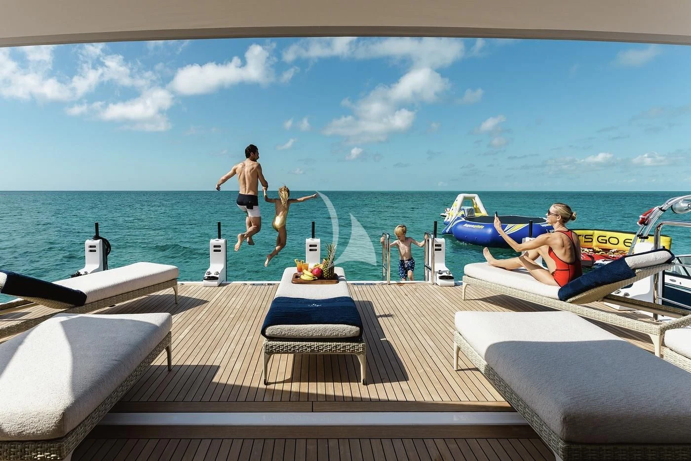 a group of people jumping off a dock into a pool aboard STARBURST IV Yacht for Charter