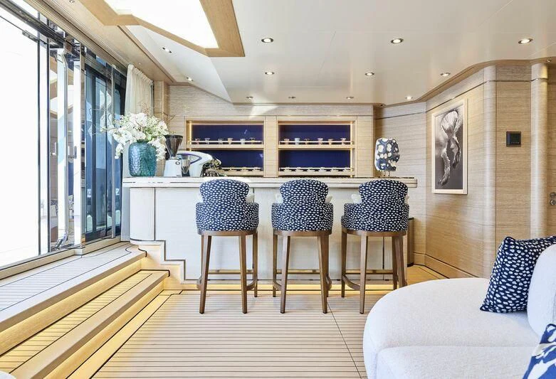 a kitchen with a table and chairs aboard STARBURST IV Yacht for Charter
