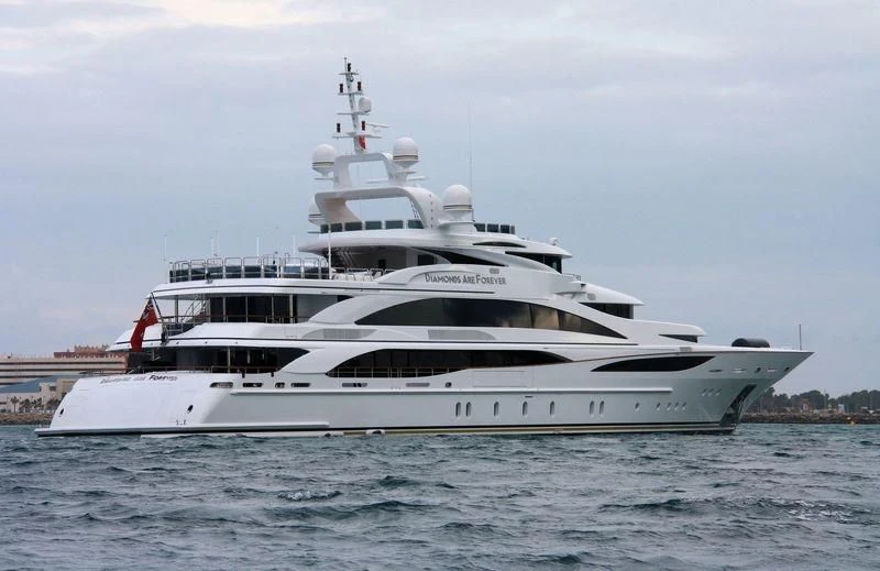 a white yacht on the water aboard DIAMONDS ARE FOREVER Yacht for Sale