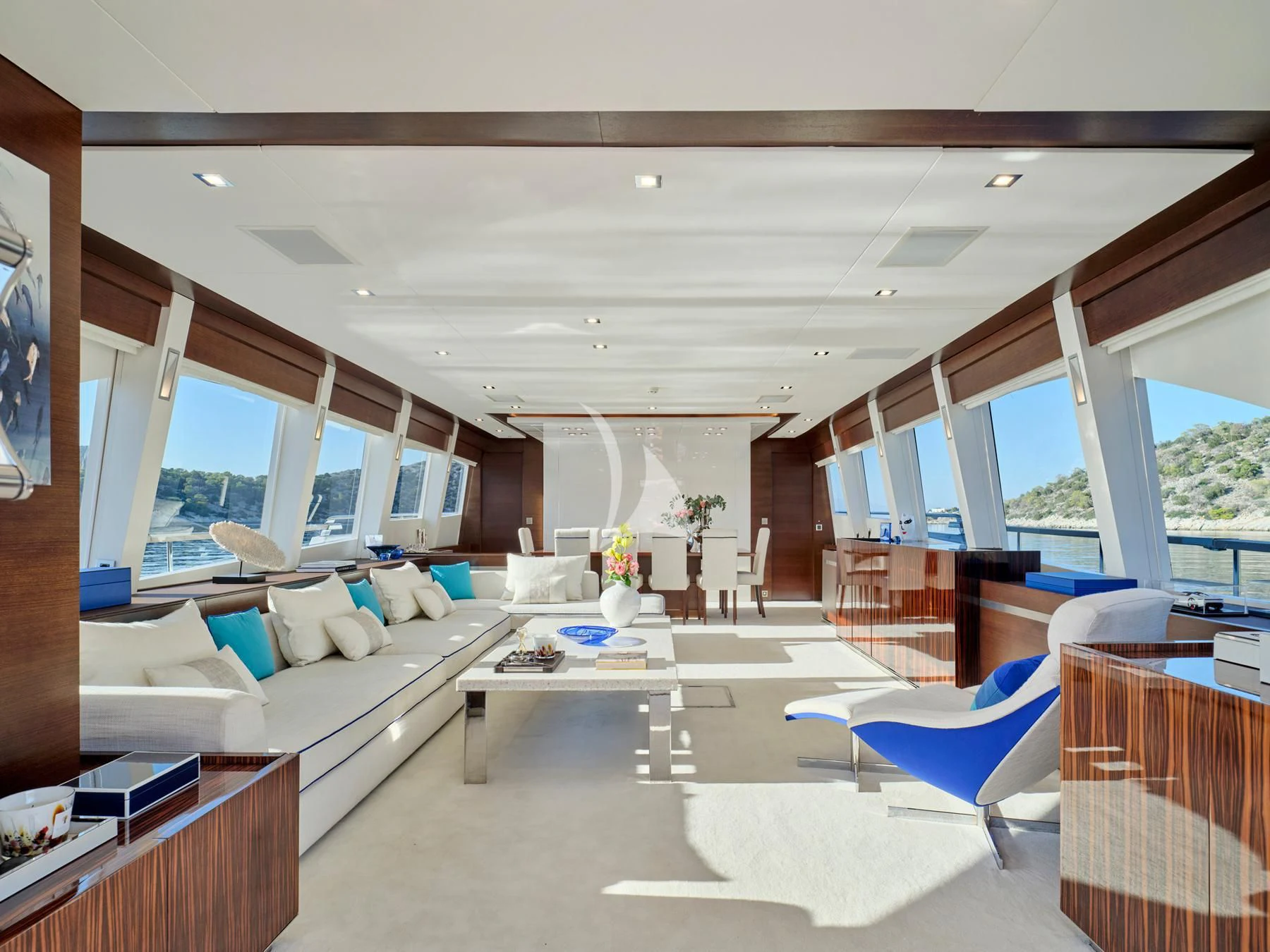 a living room with a large window aboard HAKUNA MATATA Yacht for Charter