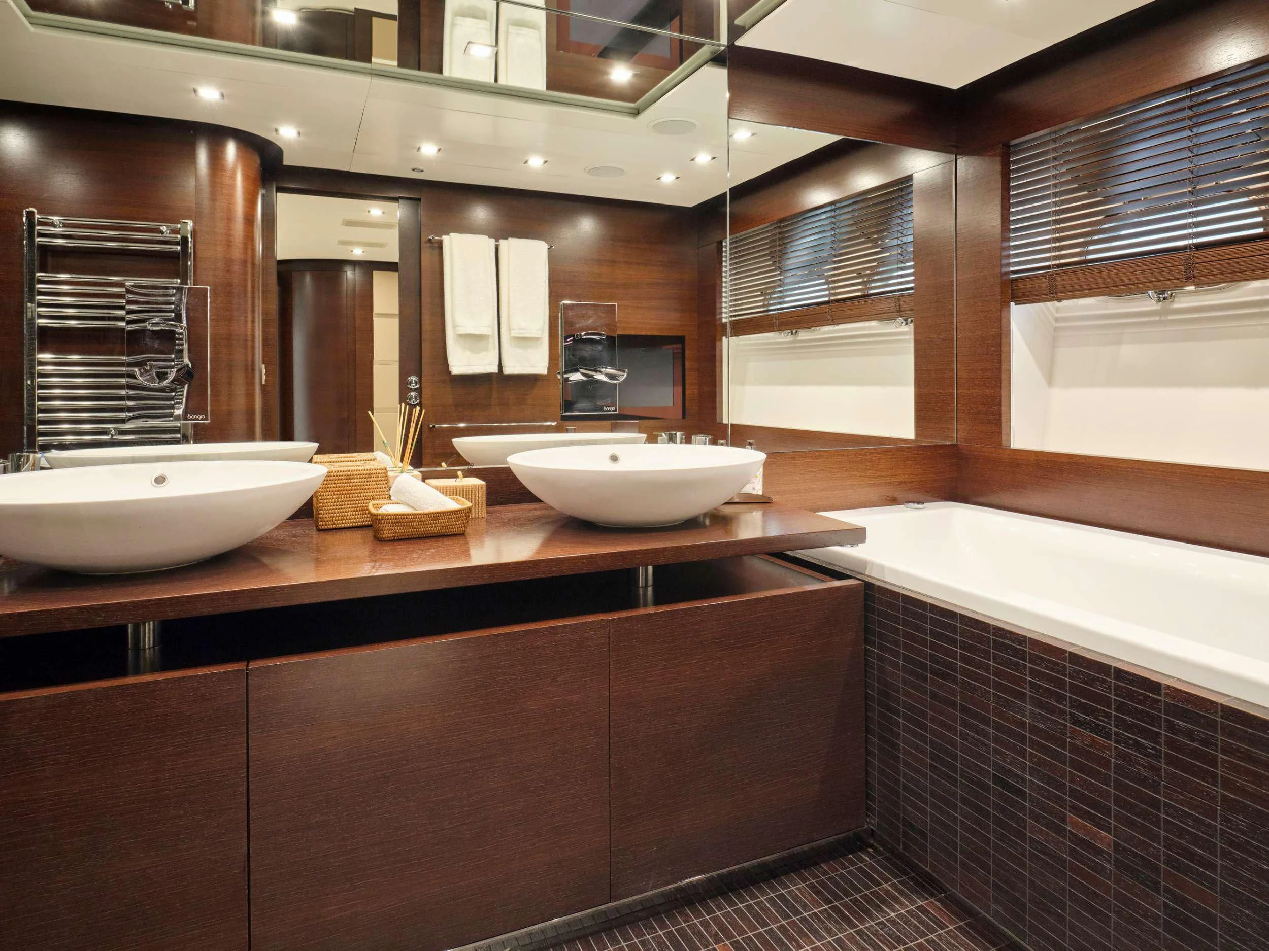 a bathroom with a sink and a bathtub aboard HAKUNA MATATA Yacht for Charter