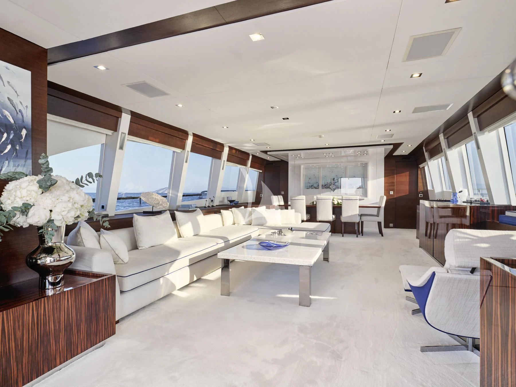 a living room with a large window aboard HAKUNA MATATA Yacht for Charter