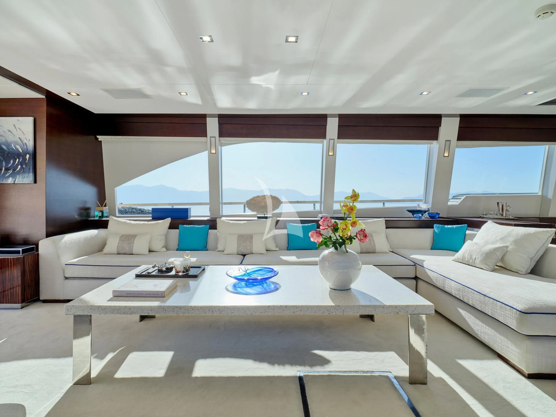a living room with a large window aboard HAKUNA MATATA Yacht for Charter