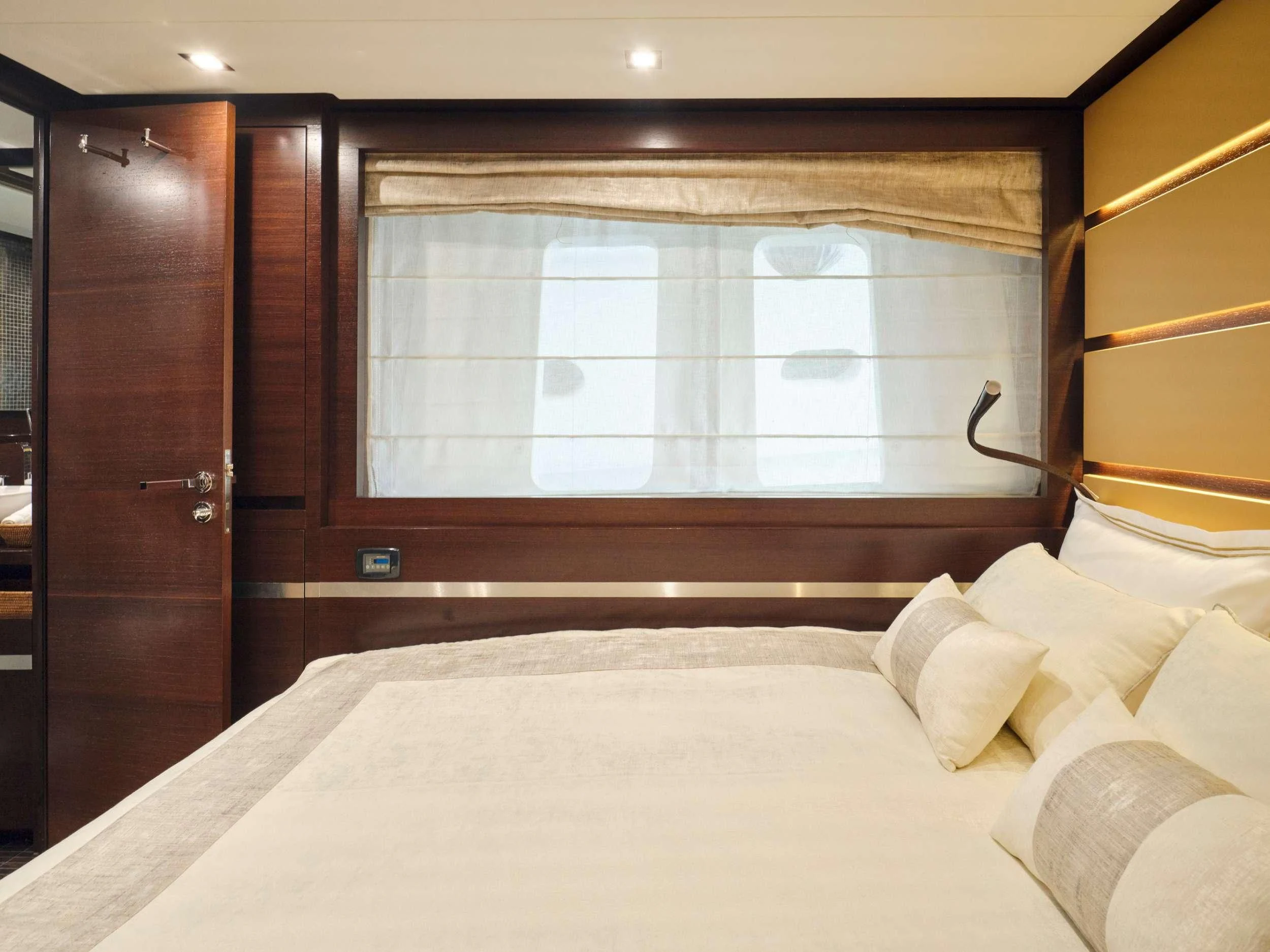 a bed with a white sheet aboard HAKUNA MATATA Yacht for Charter