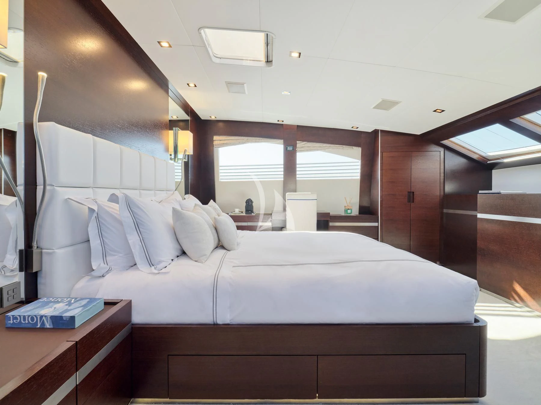 a bed with a white sheet aboard HAKUNA MATATA Yacht for Charter