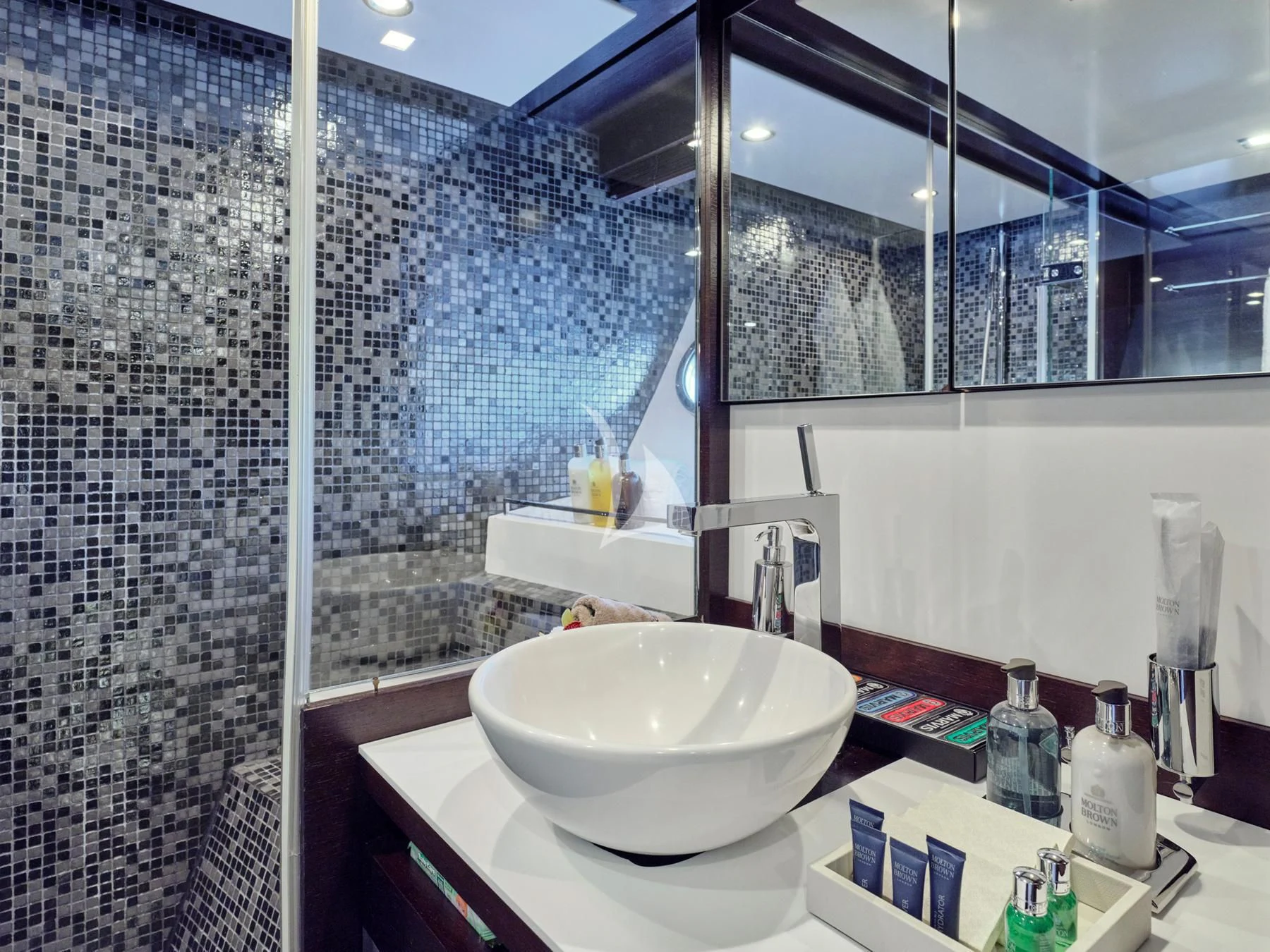 a bathroom with a sink and a shower aboard HAKUNA MATATA Yacht for Charter