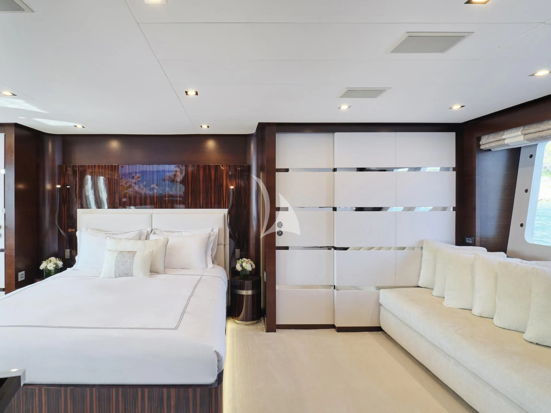 a room with white couches aboard HAKUNA MATATA Yacht for Charter