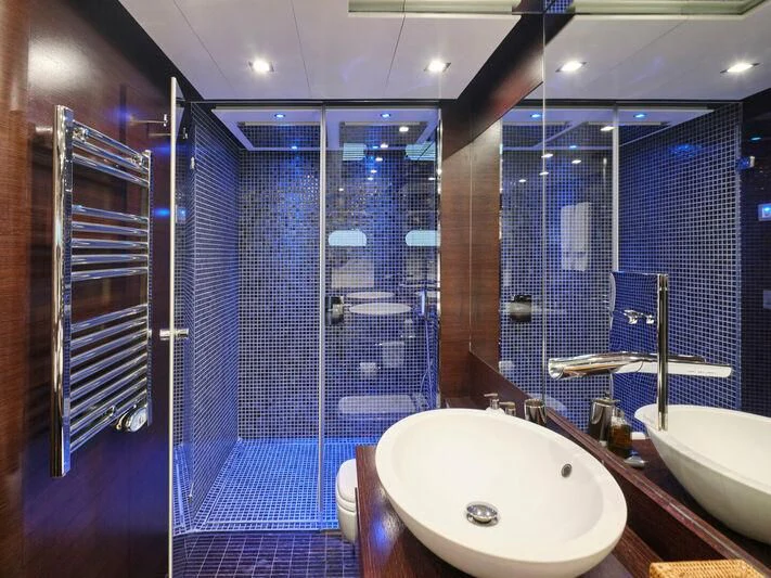 a bathroom with a sink and a shower aboard HAKUNA MATATA Yacht for Charter