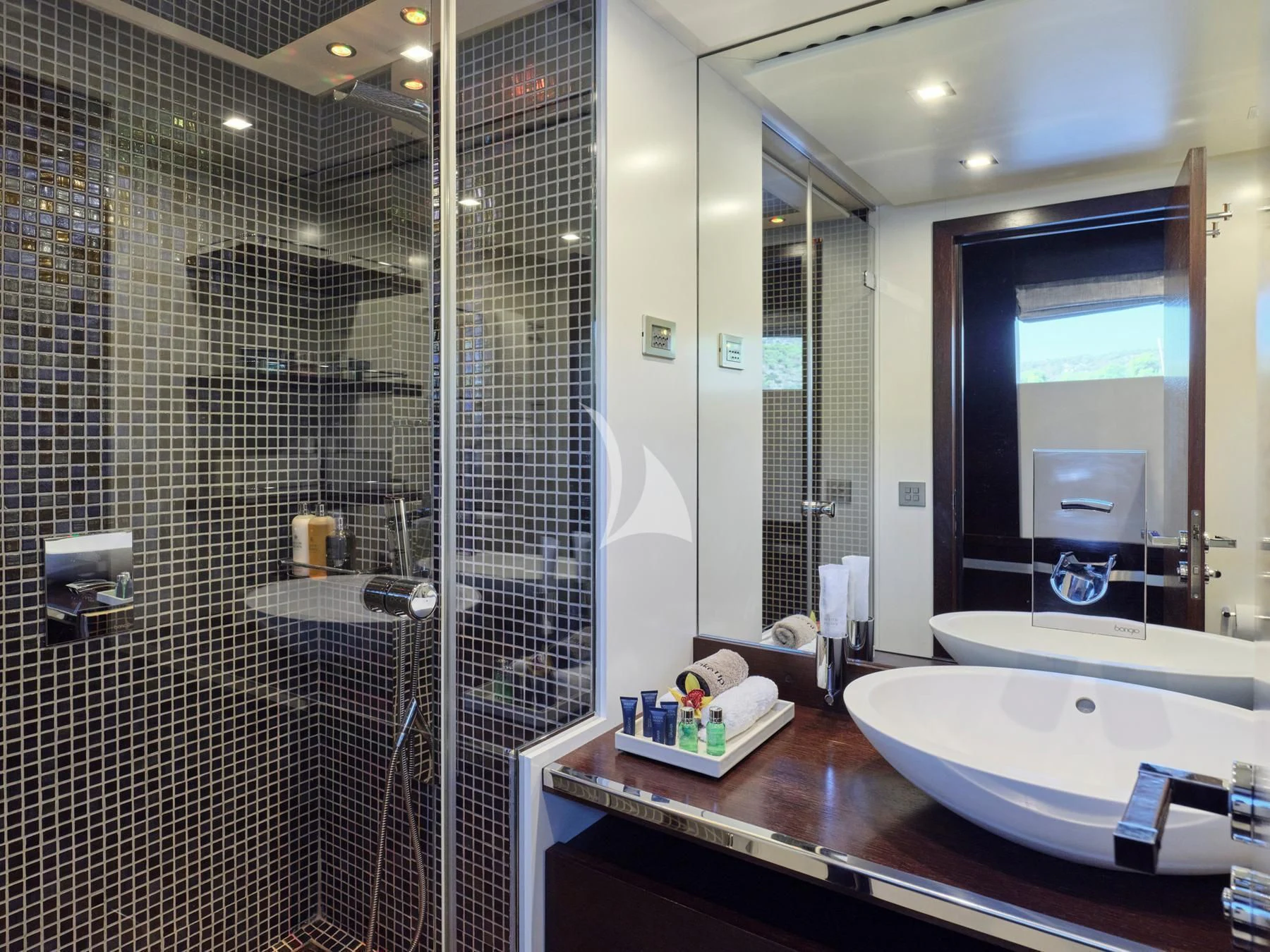 a bathroom with a large mirror aboard HAKUNA MATATA Yacht for Charter