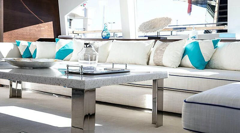 a coffee table with a glass top aboard HAKUNA MATATA Yacht for Charter