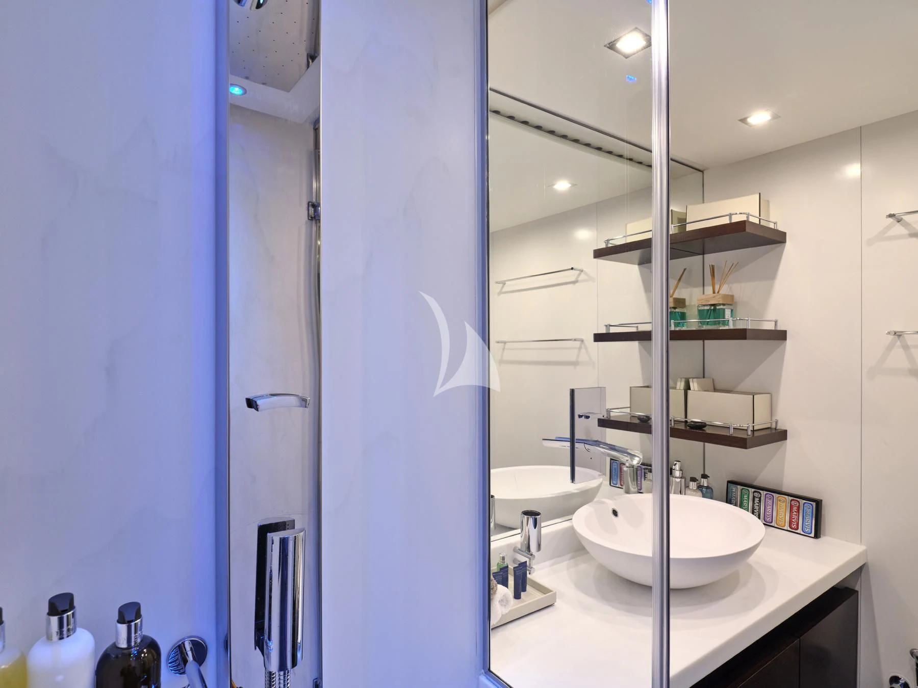 a bathroom with a glass shower aboard HAKUNA MATATA Yacht for Charter