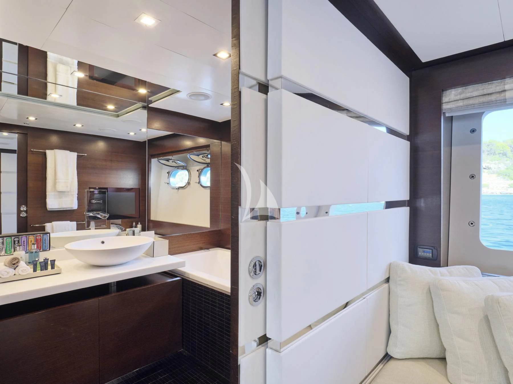 a bathroom with a sink and a mirror aboard HAKUNA MATATA Yacht for Charter