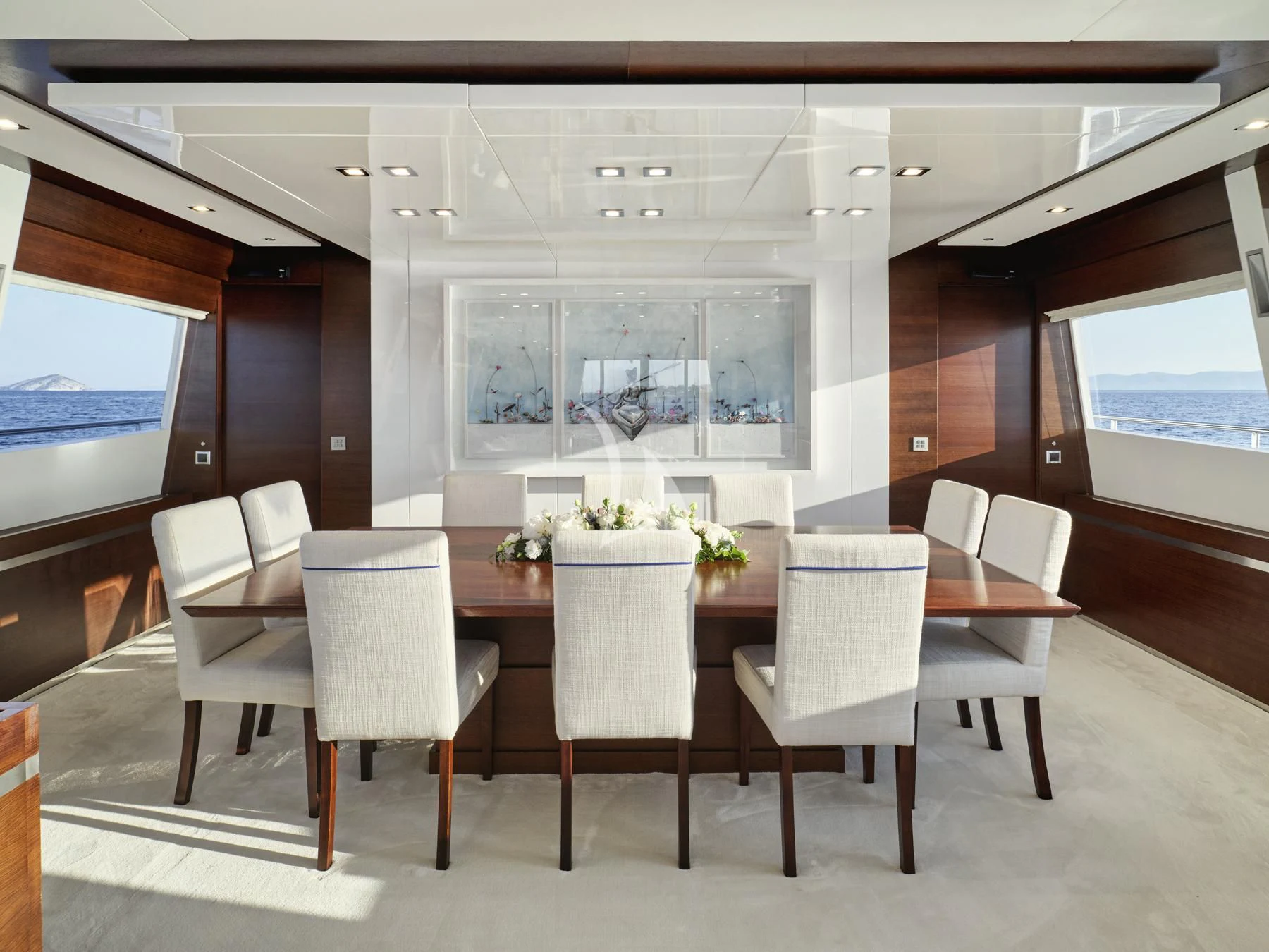 a room with a table and chairs aboard HAKUNA MATATA Yacht for Charter