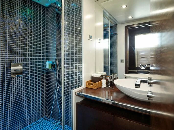 a bathroom with a sink and a mirror aboard HAKUNA MATATA Yacht for Charter