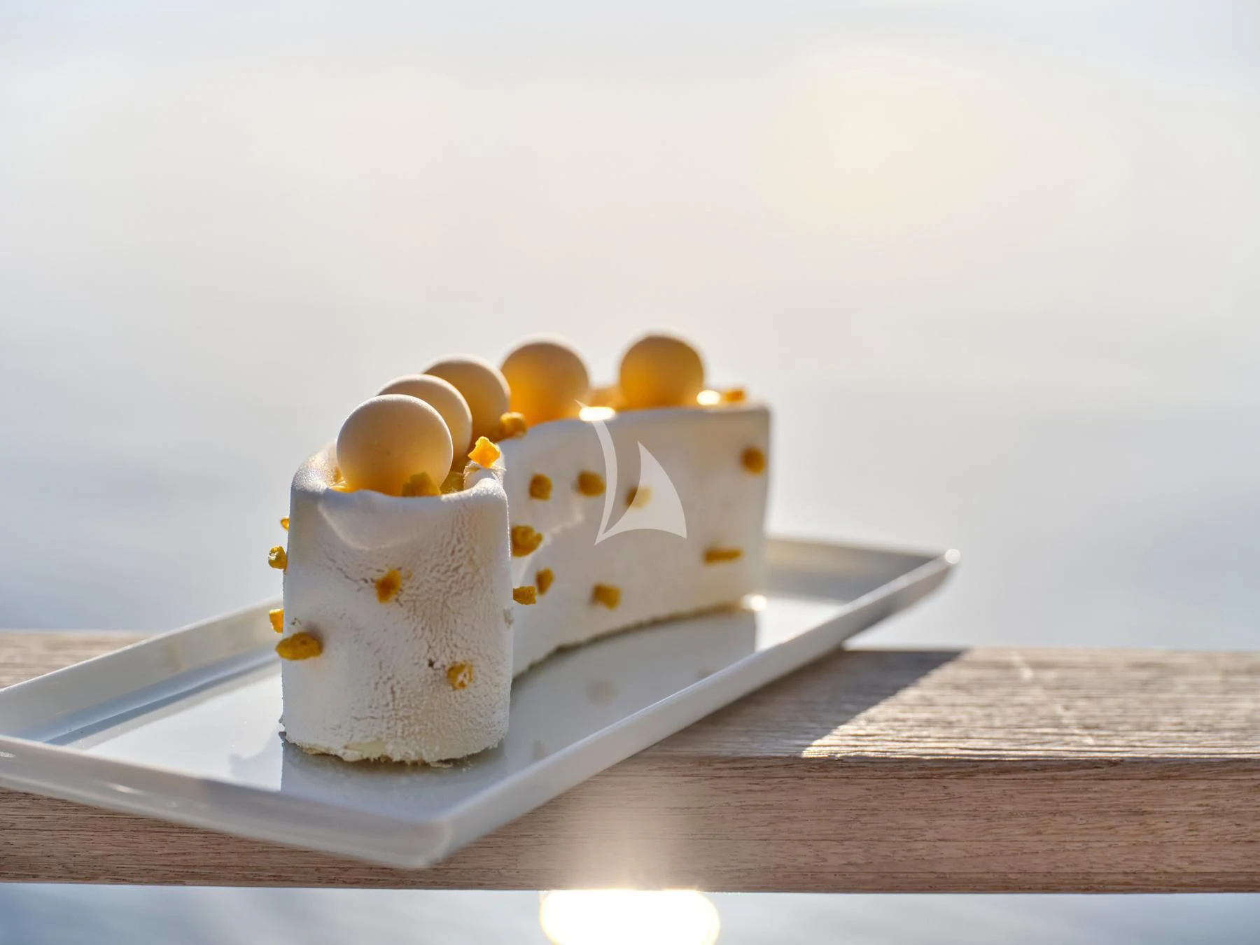 a cake with a slice cut out aboard HAKUNA MATATA Yacht for Charter