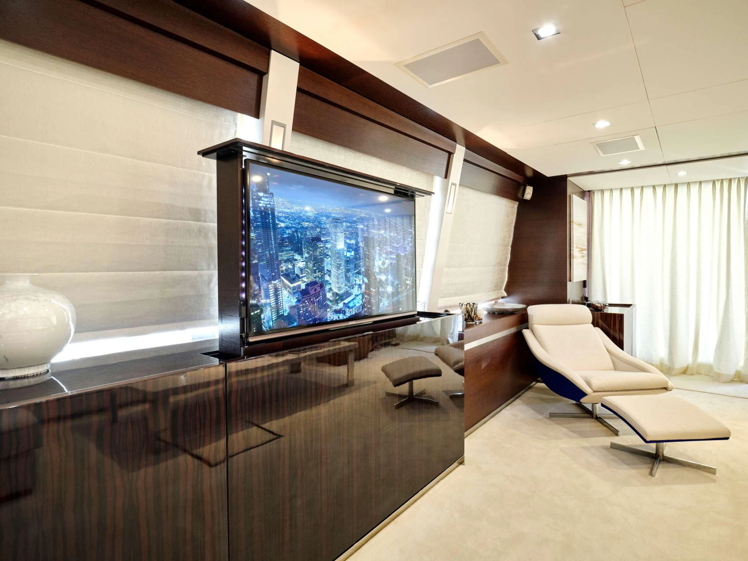 a room with a large television aboard HAKUNA MATATA Yacht for Charter